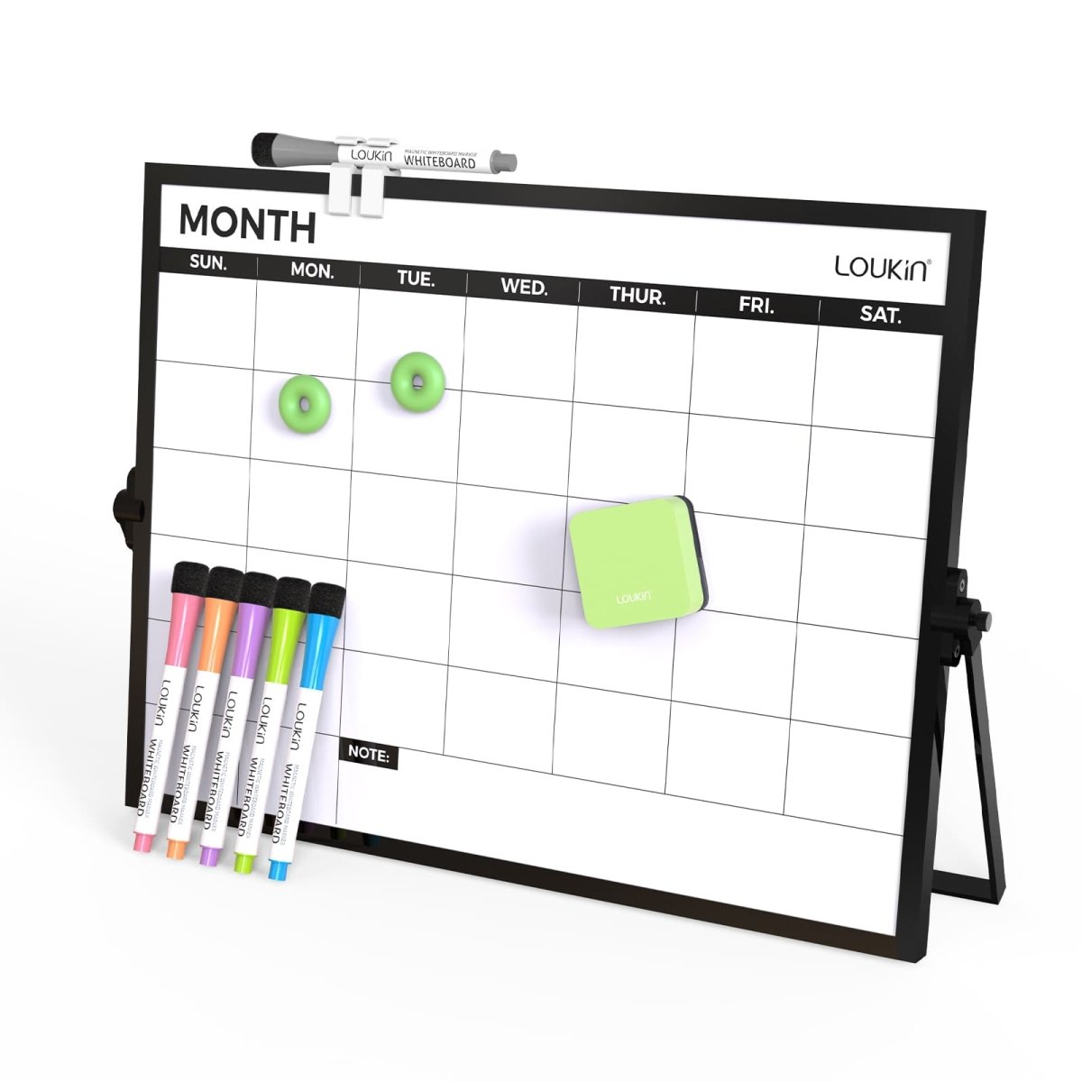Main product image of the Loukin Desktop Monthly Calendar Whiteboard (W1313K), shown standing on its black easel. The image displays the black-framed monthly calendar grid, along with its accessories: a set of five colorful fine-tip dry-erase markers, a small green magnetic eraser, two green magnetic donut-shaped pushpins, and a magnetic pen clip holding a black marker at the top.