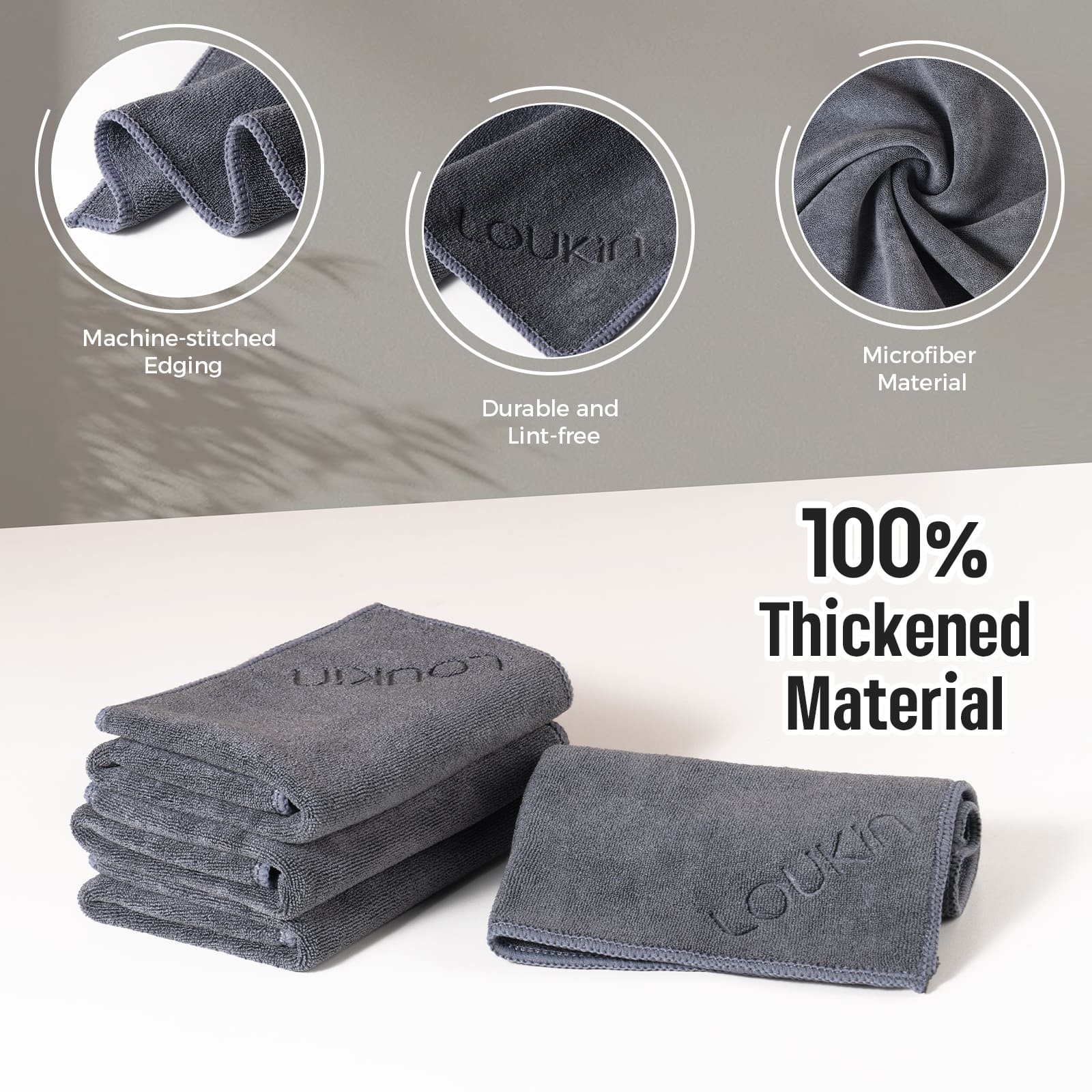 Lifestyle image featuring the Loukin Magnetic Cleaning Cloth (W3306K) in an office or classroom setting. The dark grey microfiber cloth is conveniently hanging magnetically on a large white whiteboard, ready for use. A person is actively writing on the board with a marker, illustrating the cloth's quick accessibility during a lesson or presentation.
