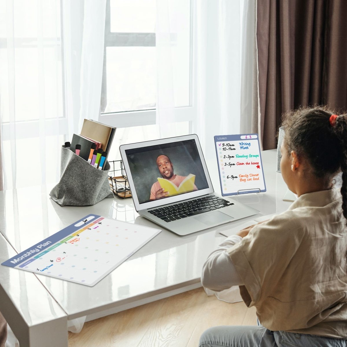 A lifestyle image showing a woman reviewing the LOUKIN Magnetic **Weekly Plan Dry Erase Calendar** (part of model W1307K) attached to a refrigerator. The calendar is filled with a weekly meal plan, with tasks like "Dinner: Chicken nuggets slow" and "Lunch: Taco Bell," emphasizing the selling point: **"Easy to Write and Erase"** for a **"More Organized Life"**.
