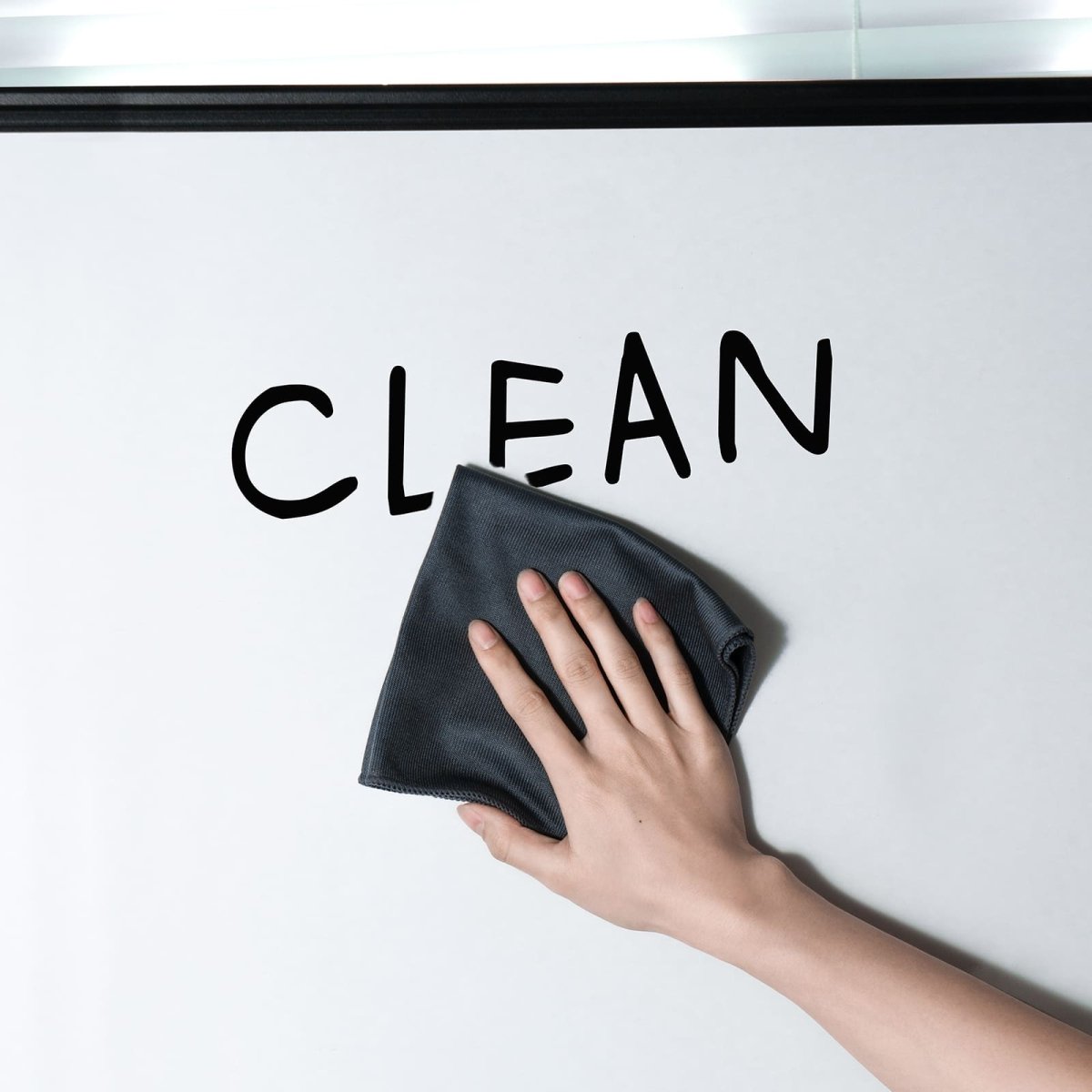 A product image showing a hand using the LOUKIN cleaning cloth, SKU W3301, to wipe the word "CLEAN" off a whiteboard.