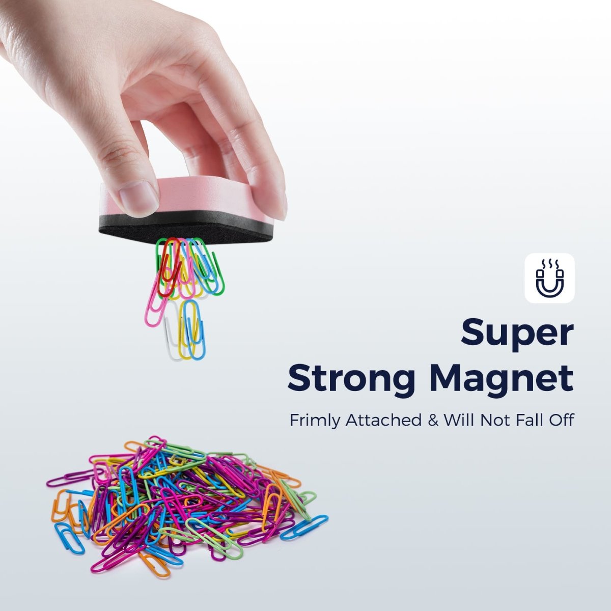 A demonstration image showing the **Super Strong Magnet** feature of the pink LOUKIN Mini Dry Erase Eraser, model W3526K. The eraser is holding and lifting a large handful of colorful paperclips, demonstrating that it is firmly attached and will not fall off.