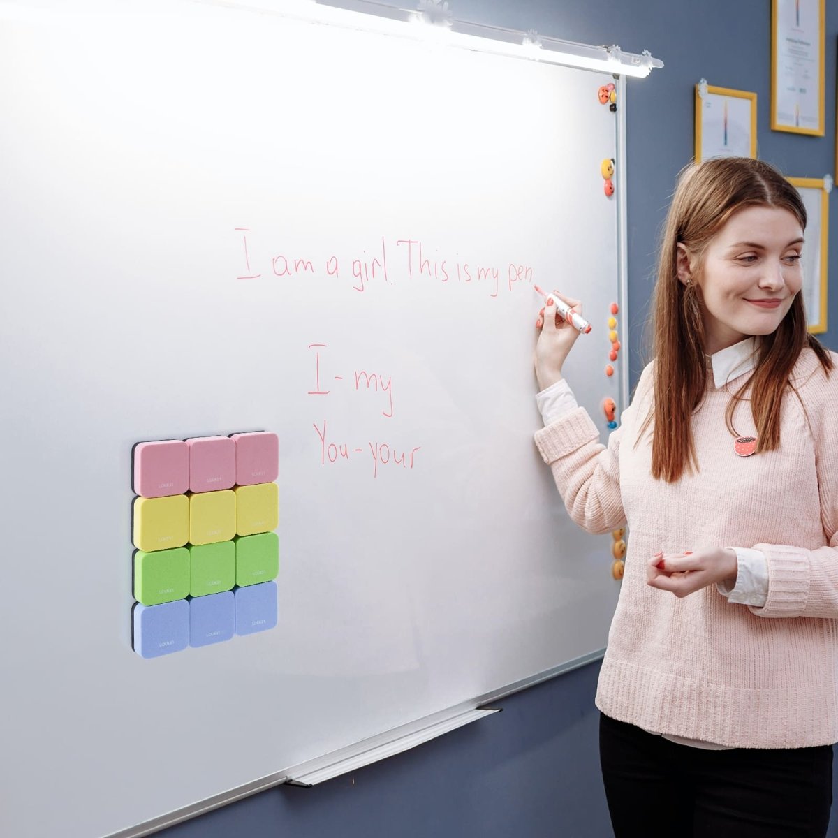 A four-panel image demonstrating the versatile usage scenarios for the LOUKIN Mini Dry Erase Eraser, model W3526K, in different environments. The scenarios include: **Home** (a child drawing), **Office** (a man writing on a large whiteboard), **School** (students raising hands), and **Training institution** (a modern training room).
